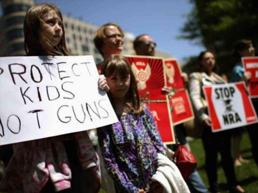 Anti-gun violence demonstrators outside the National Rifle Association in Washington DC. AGENCIES