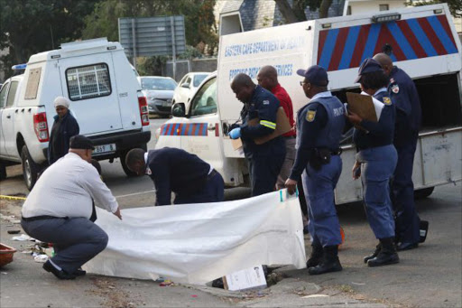 A body of an unidentified man was discovered this morning by residents budired under a pile of rubish in St Peters Street, Southernwood . Picture: MICHAEL PINYANA
