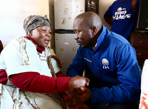 DA leader Mmusi Maimane with Fungile Mbatha, 73, during by-election campaign in Nquthu.