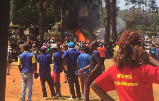 As police put out one fire another is started at the Union Buildings. Image by: Leonie Wagner