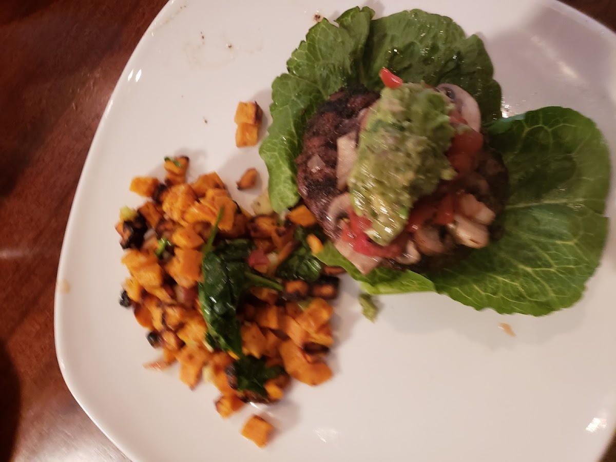 This was from the gluten free menu under Paleo meals. It's called the knife and fork burger. On a bed of lettuce with brusetta seasoned tomatoes, avocado and a side of sweet potato salad. Yum