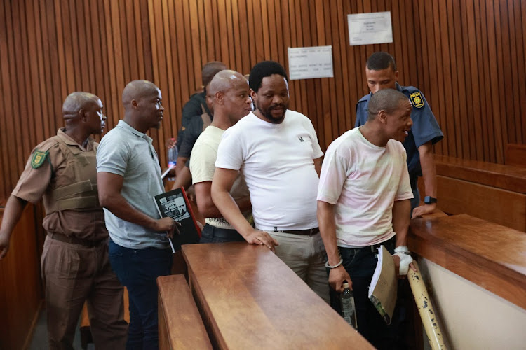 Muzi Sibiya, Fisokuhle Ntuli, Mthokoziseni Maphisa Sibiya and Mthobisi Mncube, four of the five men accused of killing former Bafana Bafana goalkeeper Senzo Meyiwa, in the Pretoria high court. File photo.