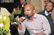 Tshepo Langa poses a question to the panelists during the recent Sowetan Dialogues.