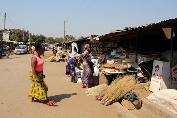 Brooms, airtime and cooking ingredients are all for sale at Dambwa Market.