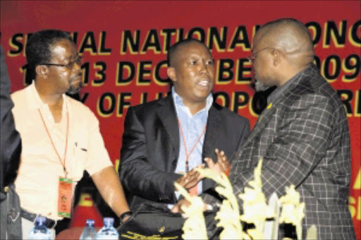 WAR OF WORDS: ANC NEC member Billy Masetlha looks on as Julius Malema and Gwede Mantashe exchange a few angry words at the SACP special national congress held at the University of Limpopo's Mankweng campus. Pic: Elijar Mushiana. 10/12/2009. © Sowetan.