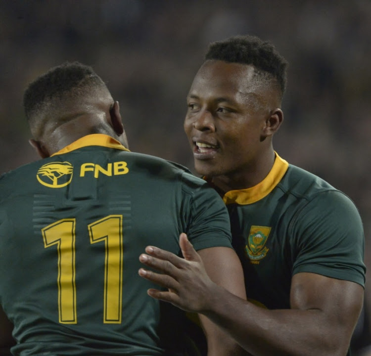 Aphiwe Dyantyi being congratulated by S’busiso Nkosi during the 2018 Castle Lager Incoming Series match between South Africa and England at Ellis Park on June 09, 2018 in Johannesburg, South Africa.