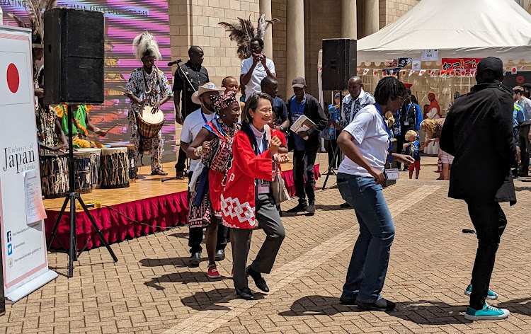 Madam Okaniwa Akane, the spouse of the Japanese Ambassador to Kenya Okaniwa Ken, dances to a traditional dance at the Nairobi National Museum during the Japan Day event held on November 18, 2023.