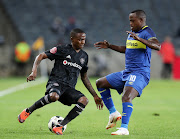 Thembinkosi Lorch of Orlando Pirates challenged by Ayanda Patosi of Cape Town City during the Absa Premiership 2018/19 match between Orlando Pirates and Cape Town City at the Orlando Stadium, Soweto on 19 September 2018.