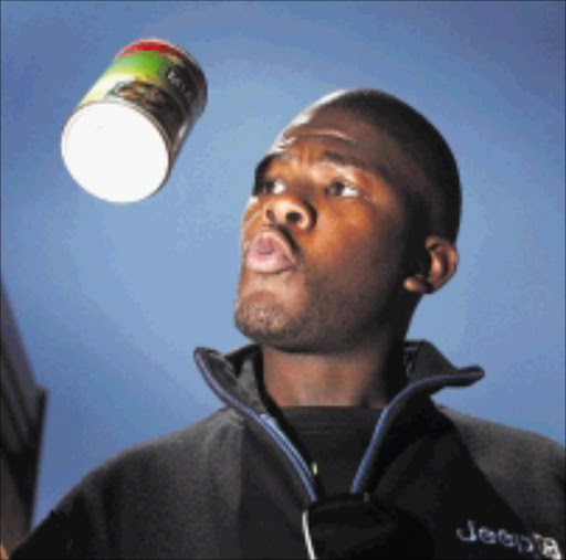 CANNED HEAT: Mo Mafatso tried out tinned chakalaka. Pic. Thys Dullaart. 25/11/2009. © THE TIMES. Isidingo actor Motlatsi Mafatso tested chakalaka for The Times Picture THYS DULLAART ------ 35 across full pic