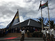 Members of the Cape Town Metro Police salute premier Alan Winde at a parade outside the Rocklands Civic Centre where the Western Cape state of the province address was held on Thursday.
