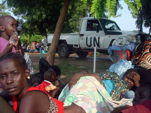 A UN truck drives past displaced South Sudanese families resting in a camp for internally displaced people in the United Nations Mission in South Sudan (UNMISS) compound in Tomping, Juba, South Sudan, July 11, 2016. /REUTERS