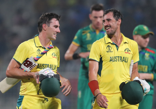 Australia’s Mitchell Starc and Pat Cummins celebrate their team’s win over SA during the ICC Men’s Cricket World Cup 2023 semifinal match at Eden Gardens in Kolkata. Picture: GALLO IMAGES/ PANKAJ NANGIA