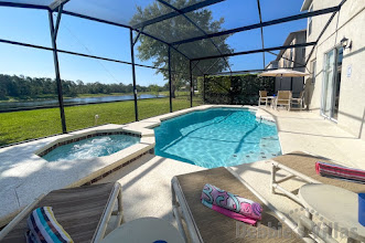 Stunning lake view from the secluded pool and spa deck at this Clermont vacation villa