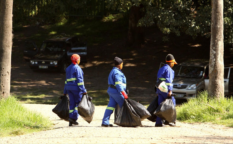 Municipal workers clean up Marina Glen in East London.