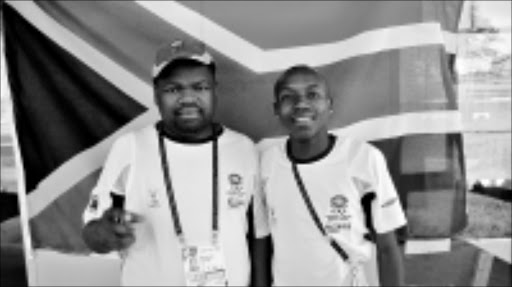 WINNER: Middle distance coach Mlungisi Mnyengeza, left, with gold medalist Sibabalwe Mzazi. Pic. circa July 2009. © Unknown.