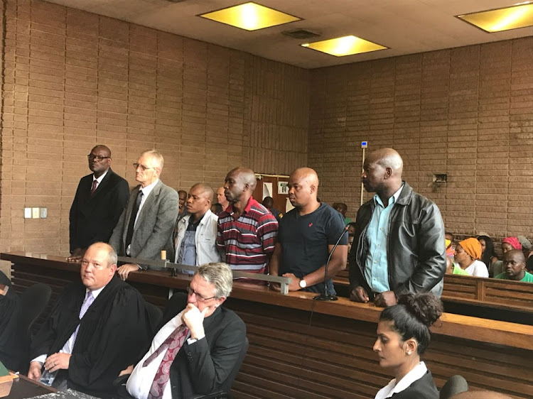 Former North West Deputy Police Commissioner William Mpembe alongside,Salmon Vermaak, Nkosana Mguye, Collin Mogale, Katlego Sekgweleya and Khazamola Makhubela appearing in the Rustenburg Magistrate's Court on charges of murder and defeating the ends of justice.