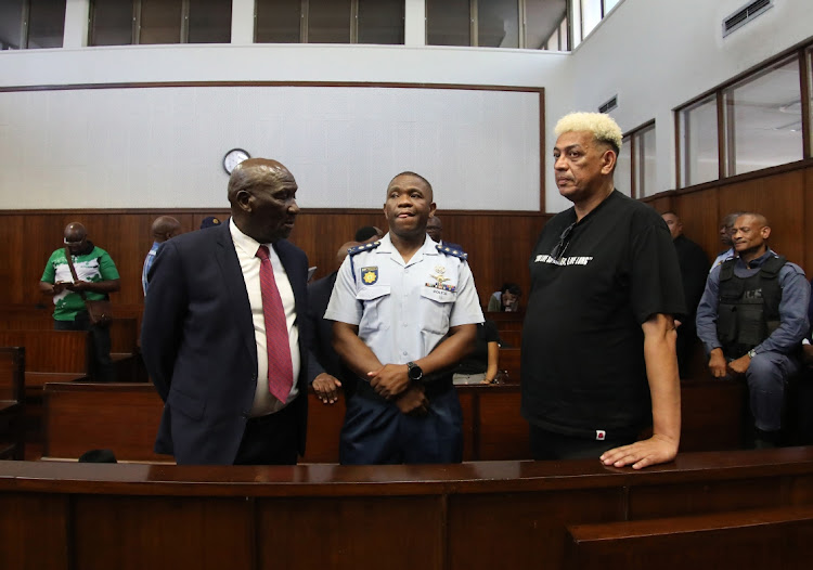 Police minister Bheki Cele, KZN police commissioner Nhlanhla Mkhwanazi and AKA’s father Tony Forbes in court on Thursday.