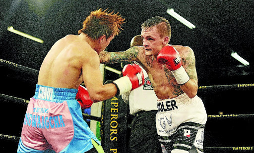 Hekkie Budler and Filipino Joey Canoy exchange blows during their IBO junior flyweight fight which Budler won by an eighth-round stoppage at Emperors Palace on Saturday night. photo: Veli Nhlapo