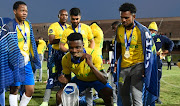 Teboho Mokoena of Mamelodi Sundowns celebrates with teammates after winning his first league championship five months after joining. 