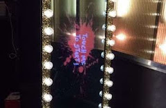 a selfie mirror that says touch to start