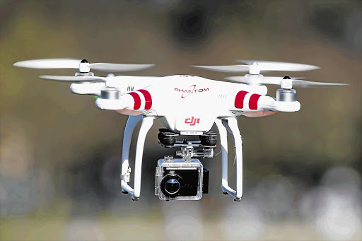 CONTROLS WANTED: A DJI Phantom drone, equipped with a camera, flies during the 4th Intergalactic Meeting of Phantom's Pilots in Paris. South African drone operators have appealed for regulation