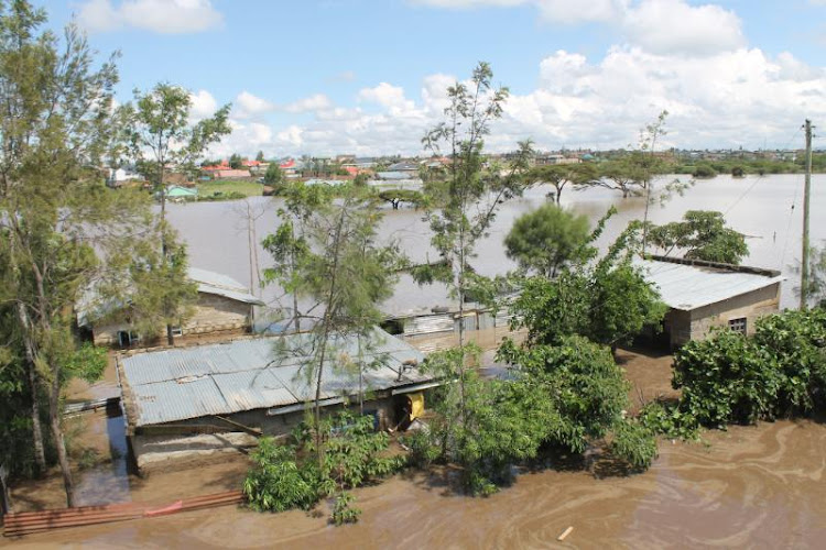Houses marooned by flood waters following heavy downpour