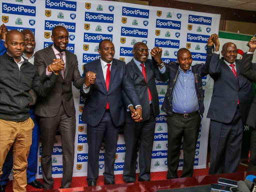 SportPesa Chief Executive Officer Ronald Karauri poses for a photograph with officials of Kenyan football clubs after the signing of new partnership deals, April 23, 2018. /SPORTPESA