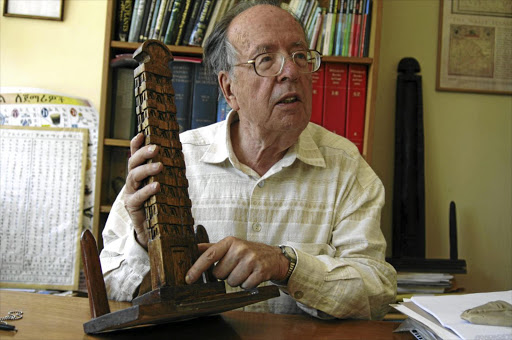 Historian Richard Pankhurst in 2005 with a model of the Aksum obelisk, the 180-ton original of which he successfully campaigned to have returned that year from Rome where it had been erected after being plundered by Mussolini.