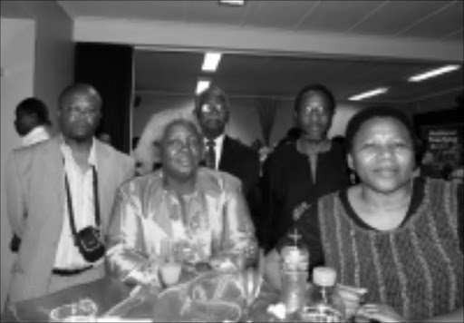 REMEBER: Members of the Goniwe family and close friends. Front row: Ntsiki Biko, wife of Black Consciousness leader Steve Biko, and Nyameka Goniwe, widow of Matthew Goniwe. 05/11/08. © Unknown.