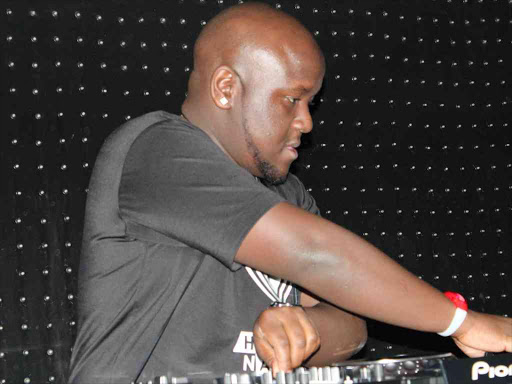 DJ Joe Mfalme on ones and twos during the Smirnoff Ice Electric Ginseng launch party. Photo/MOSES MWANGI