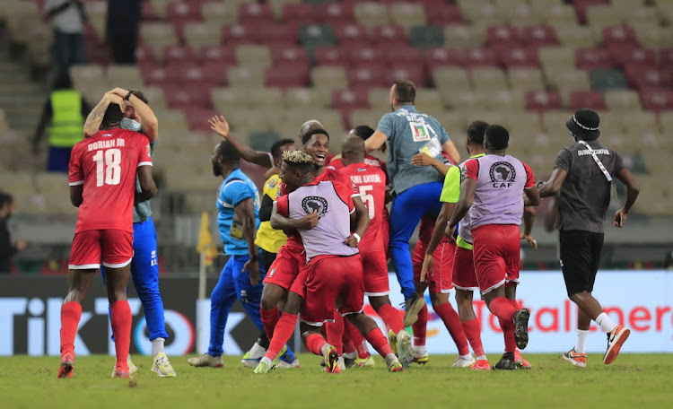 Equatorial Guinea players celebrate after the match against Algeria in Douala.