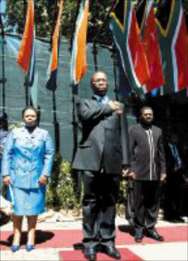 CONTROVERSIAL: KwaZulu-Natal Premier Sbusiso Ndebele salutes the guard of honour after his state of the province address yesterday. With him are: his wife Zama Ndebele, and leader of the government business and MEC for finance and economic development Dr. Zweli Mkhize. Pic. siyabonga Mosunkutu. © Sowetan.