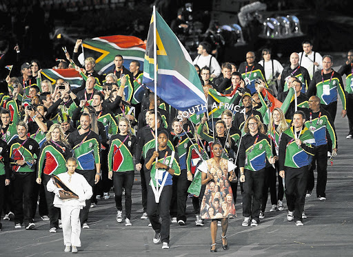 CHOSEN FEW: South Africa's Olympic team, led by track star Caster Semenya, parades at the opening ceremony of the London 2012 Olympic Games. The qualifying criteria for South African athletes - dictated by the country's own local Olympic committee - were among the toughest in the world. This meant some athletes with impressive records were left cooling their heels back home as a relatively small contingent travelled to the UK to compete.