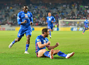SuperSport United captain Dean Furman celebrates with teammate Onismor Bhasera during the MTN8 quarter final match against Orlando Pirates and at Orlando Stadium, Johannesburg on August 11 2018.