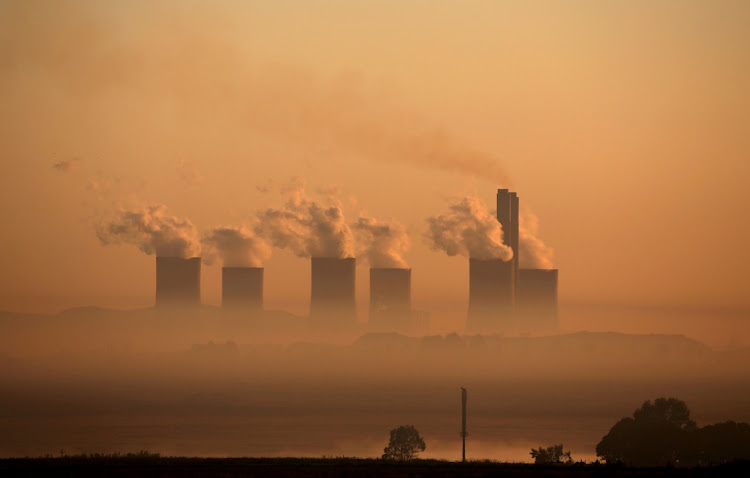 Steam rises at sunrise from the Lethabo Power Station, a coal-fired power station owned by state power utility ESKOM near Sasolburg on March 2 2016. REUTERS/SIPHIWE SIBEKO