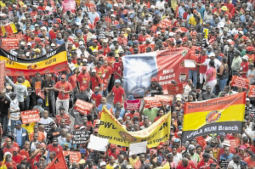 NOT IN OUR NAME: Thousands of Cosatu members marched in Johannesburg yesterday to show their rejection of labour brokers and e-tolling. Cosatu general secretary Zwelinzima Vavi addressed the crowd. PHOTO: MOHAU MOFOKENG
