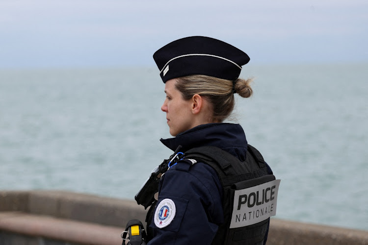 A police officer looks on in Wimereux, near Calais, after migrants died in an attempt to cross the English Channel, in France, April 23 2024. Picture: Reuters/Yves Herman