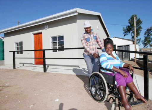 NEW BEGINNINGS: Wheelchair-bound Nomalanga Ndamase in front of her newly built RDP house in New Payne village, Mthatha Picture: LULAMILE FENI