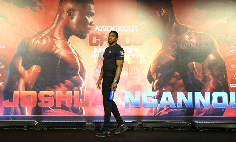 Anthony Joshua poses for a photo during the Grand Arrivals at Boulevard World, Greek World in Riyadh, Saudi Arabia on Monday.