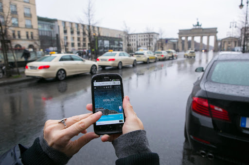 A smartphone displays the Uber car service app.