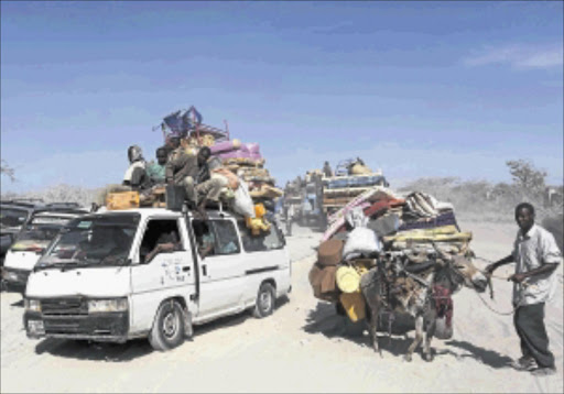 CHAOS: Somali families flee on foot and trucks from al Shabaab-held towns to Mogadishu.