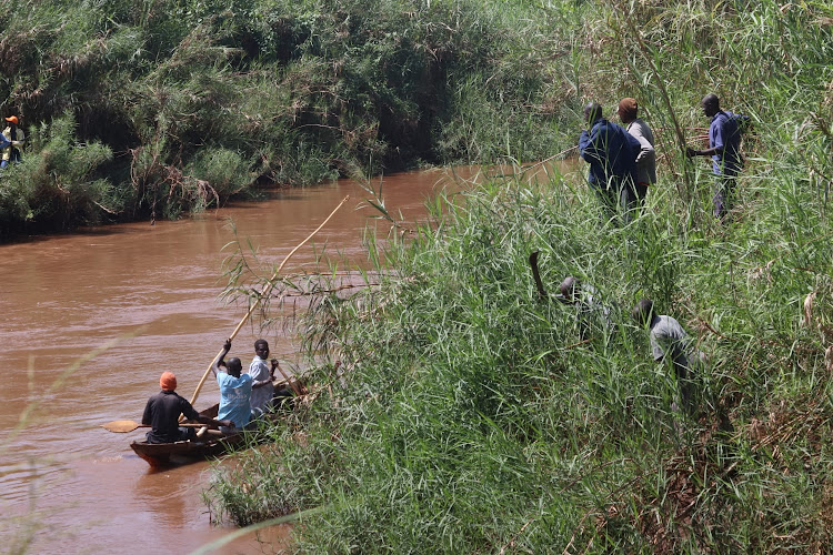 Some residents and local divers help in looking for the boy who was attacked and killed by crocodile in River Kuja, Ndhiwa constituency on February 1, 2024