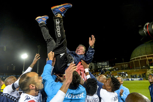 Bidvest Wits head coach Gavin Hunt hoisted in the air by the team after the Clever Boys won the 2016/17 PSL champions at the Absa Premiership following a match against Polokwane City at Bidvest Stadium on May 17, 2017 in Johannesburg, South Africa.