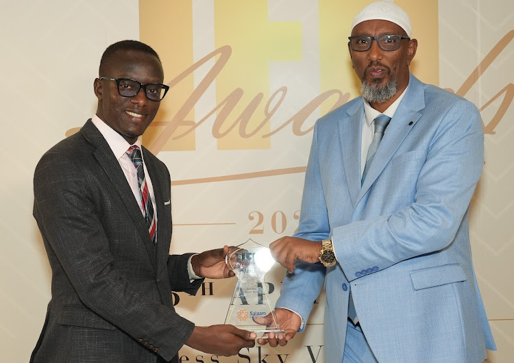 Salaam Bank Uganda Board chairman Ibrahim Abdirahman (right) and Chief Executive Officer Michael Mande receiving the award in Dubai on April 25, 2024