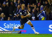 Duhan van der Merwe on his way to scoring Scotland's third try to complete his hat-trick in their Six Nations Championship win against England at Murrayfield Stadium in Edinburgh on Saturday.