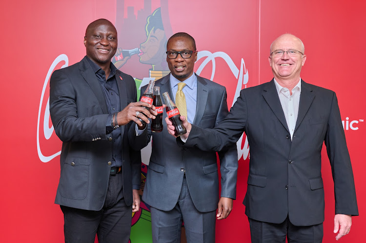 Coca-Cola East Africa Franchise Vice -President Alfred Olajide, American Chamber of Commerce (AmCham) Kenya CEO Maxwell Okello and Coca-Cola Beverages Kenya MD James Bowmaker when they announced a partnership between Coca-Cola and AmCham for the AmCham Summit.
