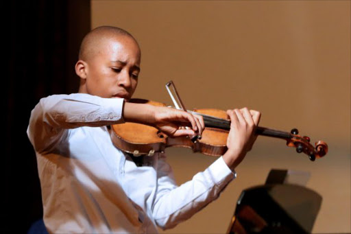 Pendo Masote, thirteen year old violinist made his debut performance at the Grahamstown Arts Festival this week Picture: Sibongile Ngalwa