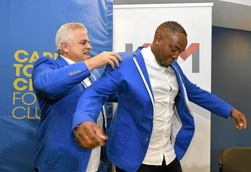 GOOD FIT: Cape Town City FC chairman John Comitis helps new coach Benni McCarthy into the club jacket.