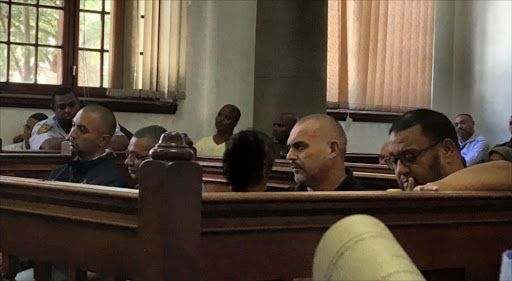 Nafiz Modack‚ Colin Booysen‚ Ashley Fields (obscured)‚ Jacques Cronje and Carl Lakay in the dock at Cape Town Magistrate's Court Image: Anthony Molyneaux