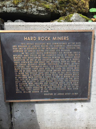   HARD ROCK MINERS  THIS BRONZE SCULPTURE WAS COMMISSIONED BY THE CITY AND BOROUGH OF JUNEAU DURING ITS CENTENNIAL ANNIVERSARY YEAR, AND IS DEDICATED TO THE MEN WHOSE WORK PROVIDED THE LIFEBLOOD...